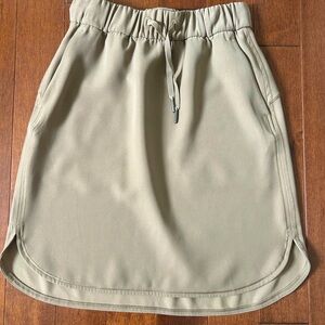 Lululemon On the Fly Skirt - tan colour, no tags but believed to be size 4.